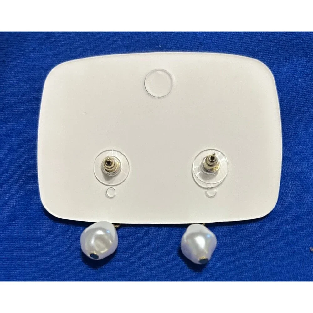2 pairs of New earrings 1 pair is gold and silver 1 pair is white pearl